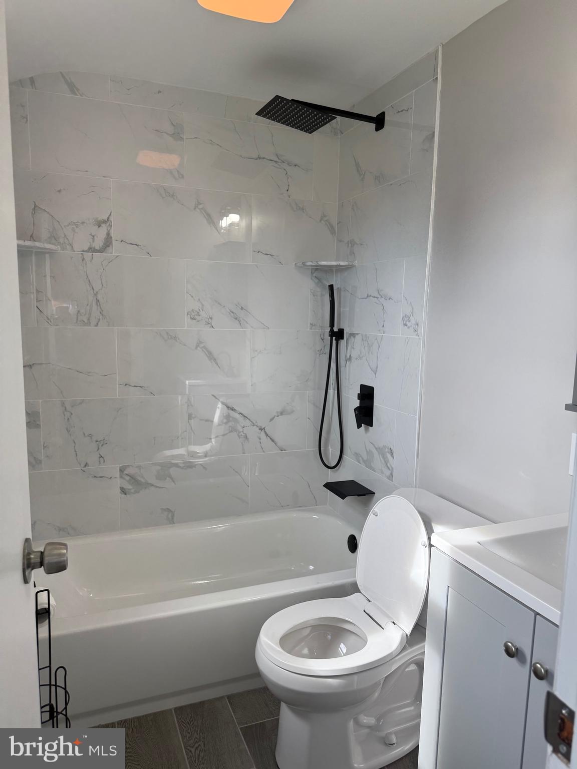 802 Fairview Road Swarthmore, PA 19081 - Photo 9 of 18 a white toilet sitting next to a bath tub and a shower