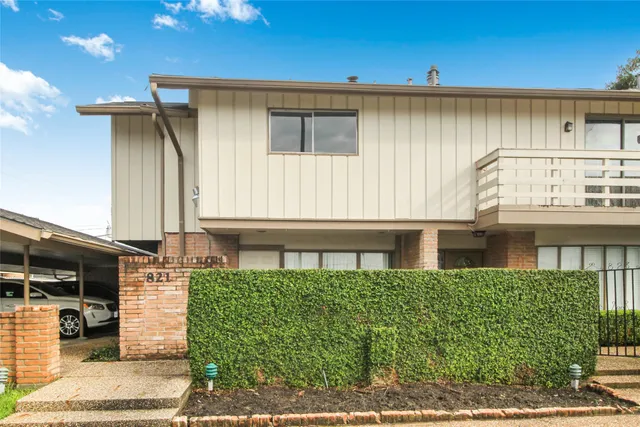 a view of house and yard with swimming pool