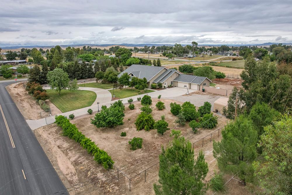 17465 Monreal Road Madera, CA 93636 - Photo 47 of 59 an aerial view of residential houses with outdoor space and lake view