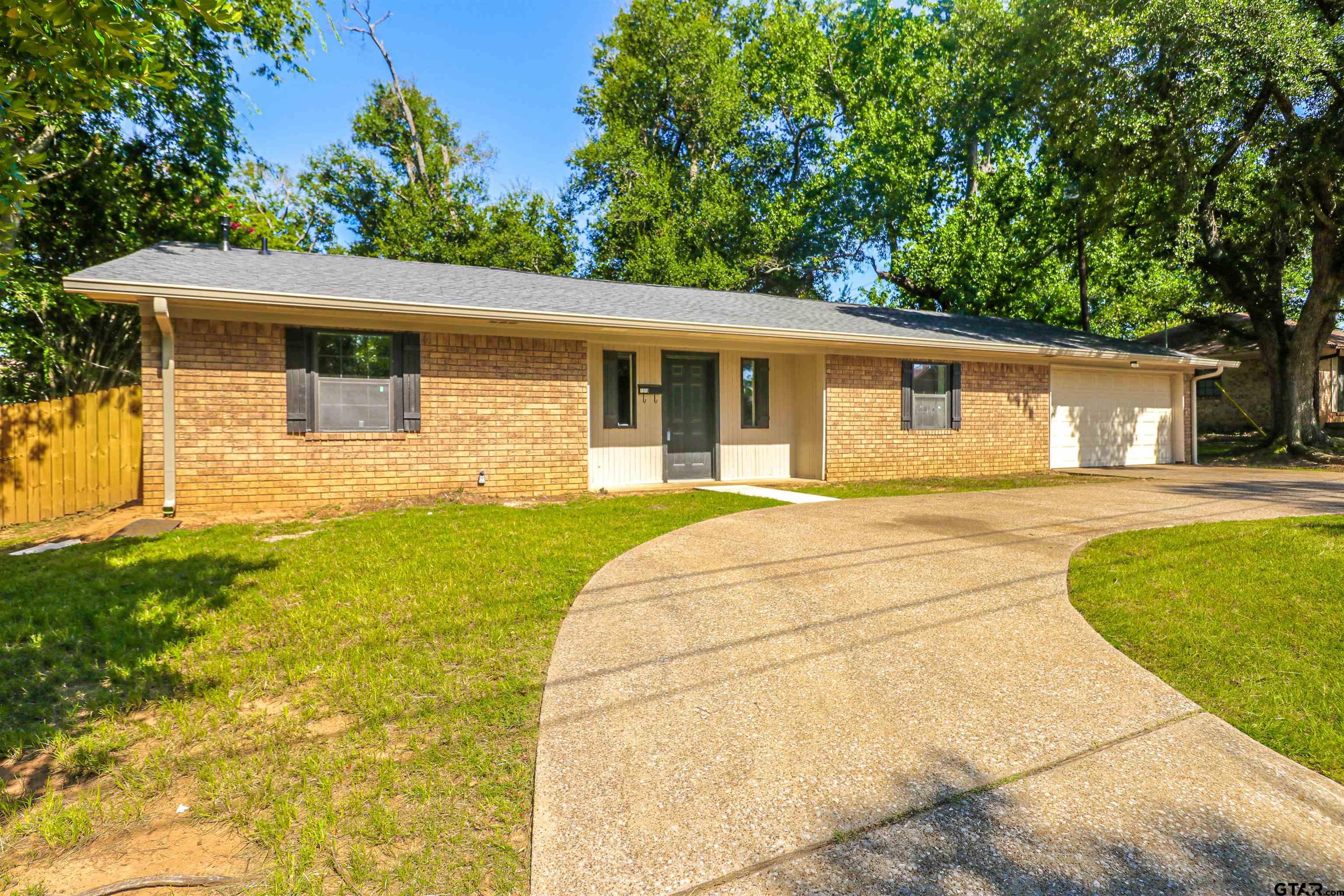 1310 Ridgeview Drive Tyler, TX 75701 - Photo 2 of 30 a house view with a outdoor space