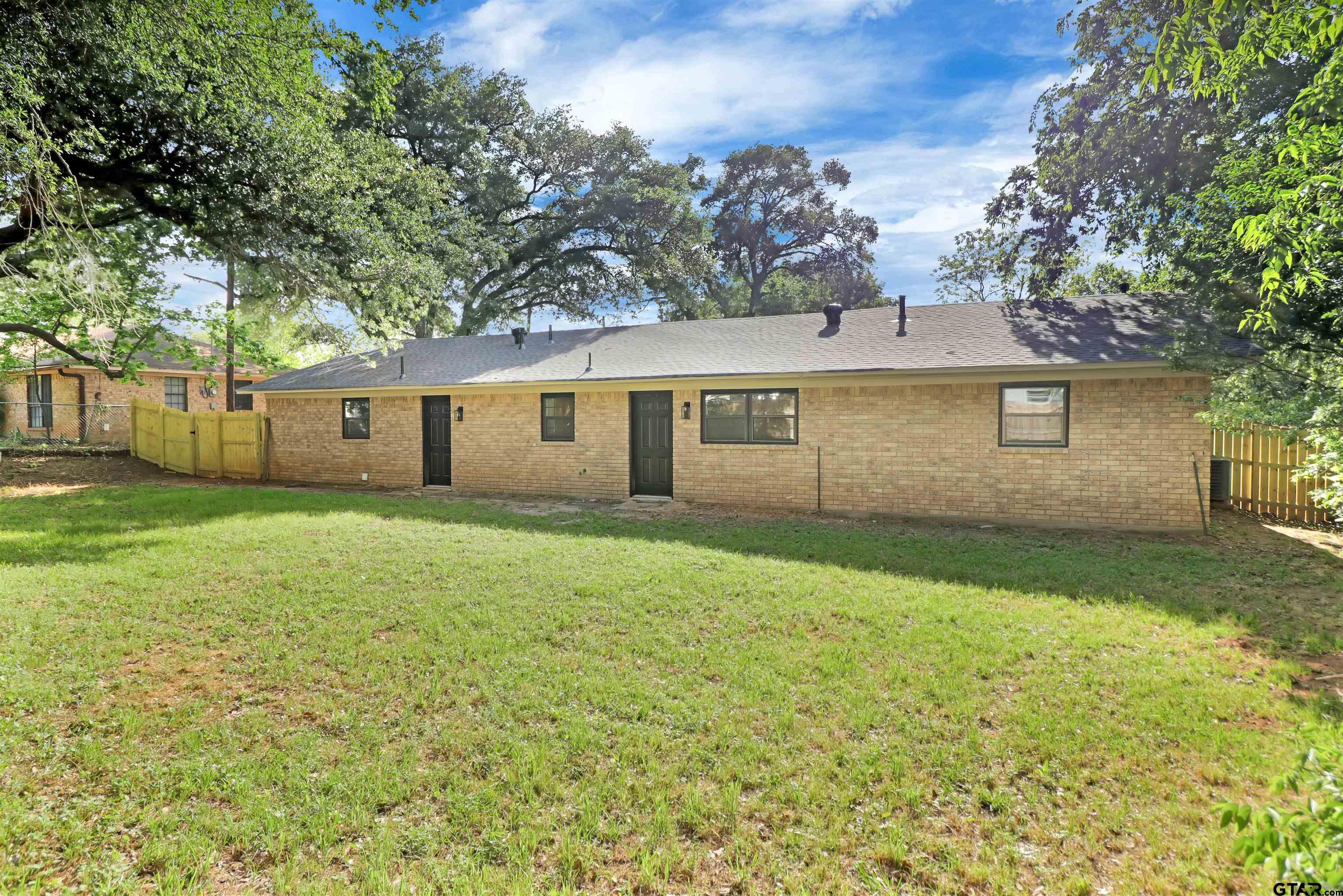 1310 Ridgeview Drive Tyler, TX 75701 - Photo 29 of 30 front view of a house with a yard