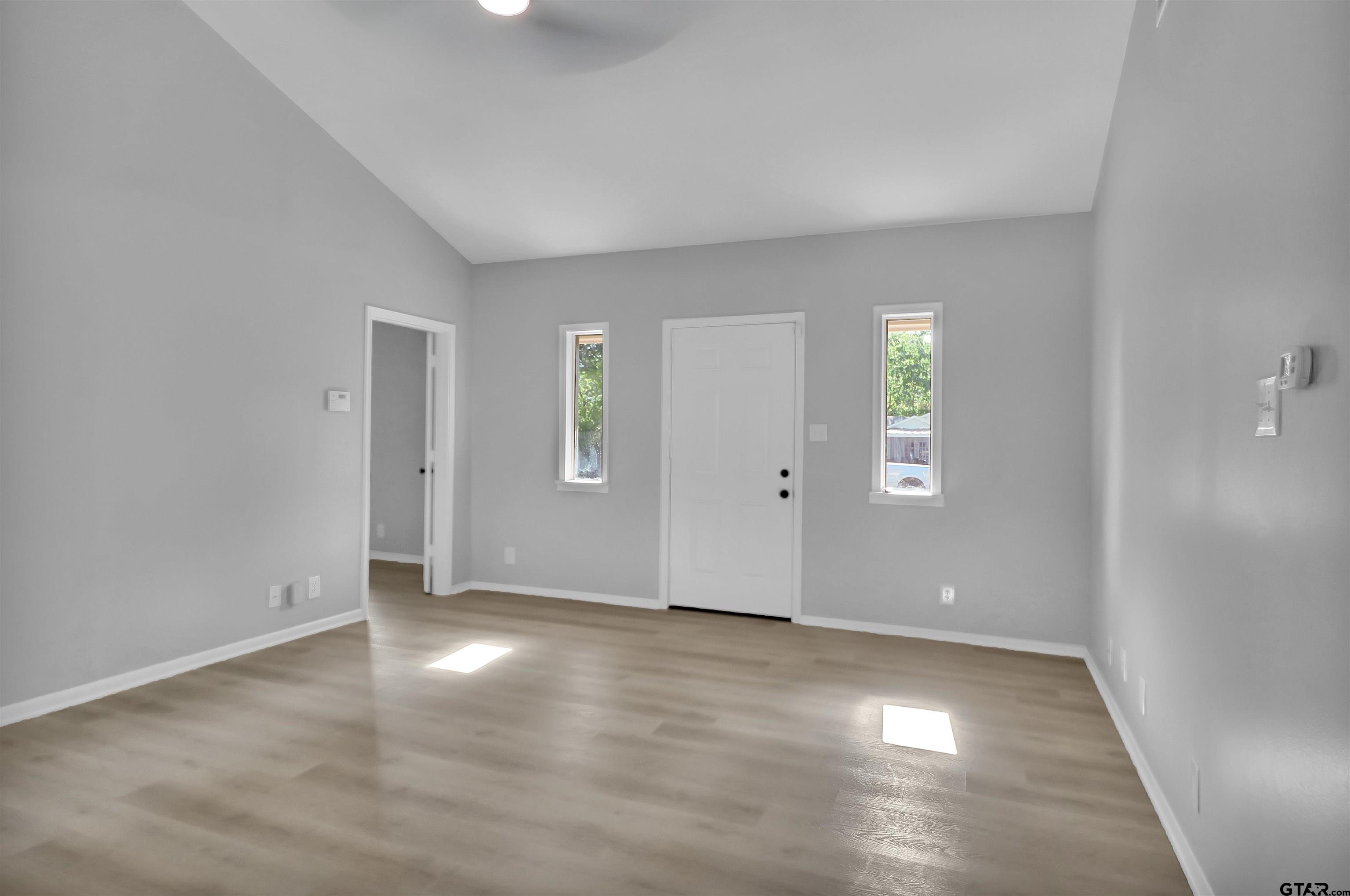 1310 Ridgeview Drive Tyler, TX 75701 - Photo 8 of 30 an empty room with windows and closet