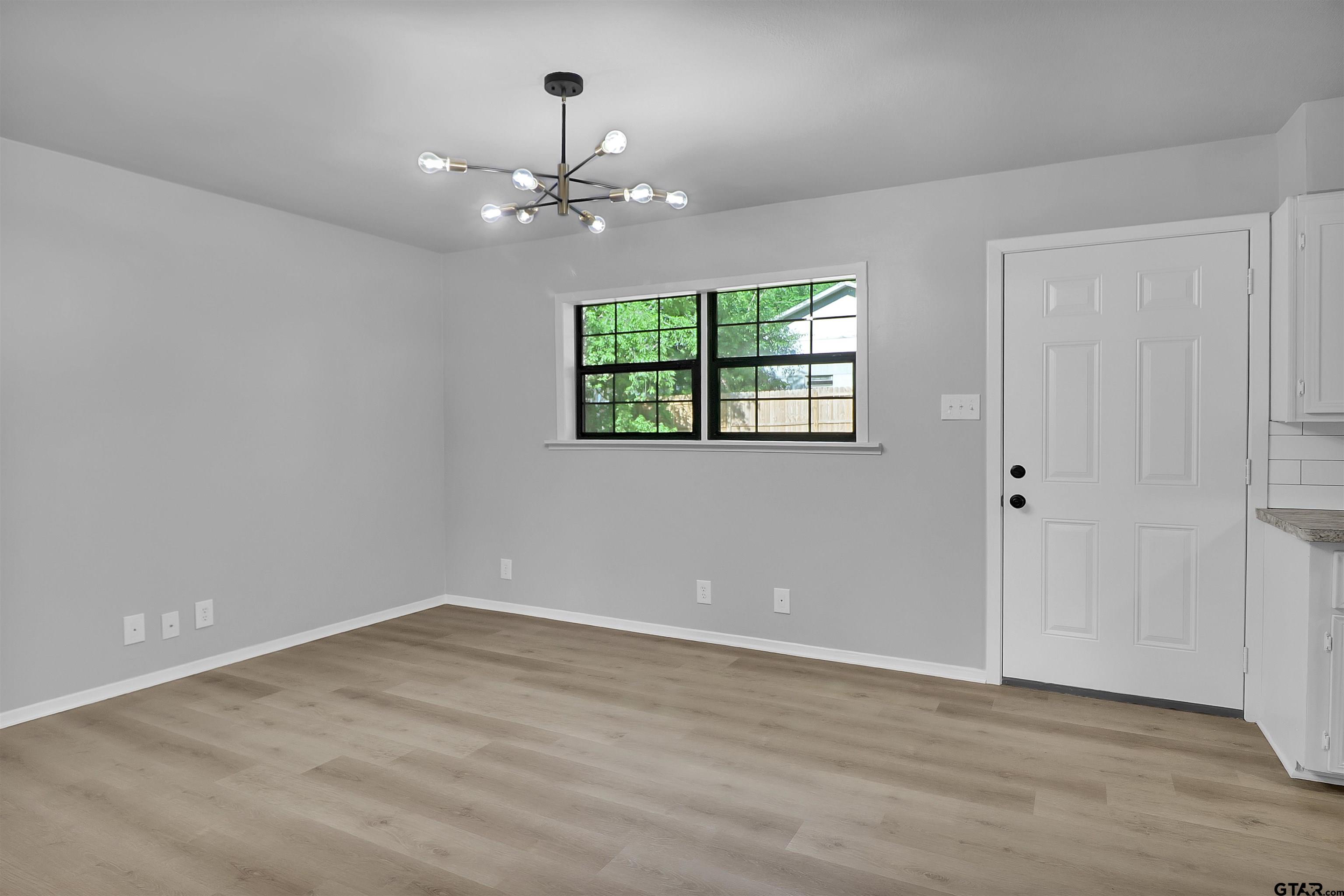 1310 Ridgeview Drive Tyler, TX 75701 - Photo 9 of 30 a view of an empty room with a window