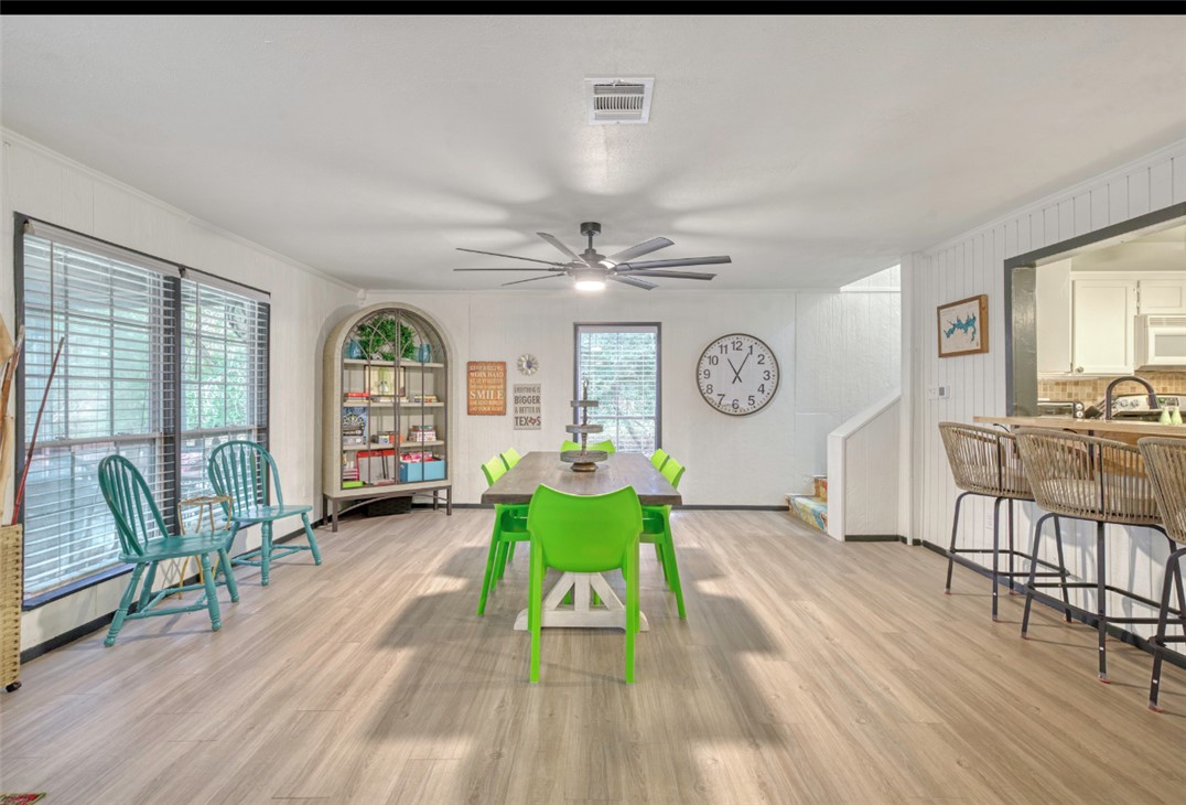 10967 Clyde Acord Road Franklin, TX 77856 - Photo 14 of 50 Dining space featuring ceiling fan, crown molding, a healthy amount of sunlight, and light wood-type flooring