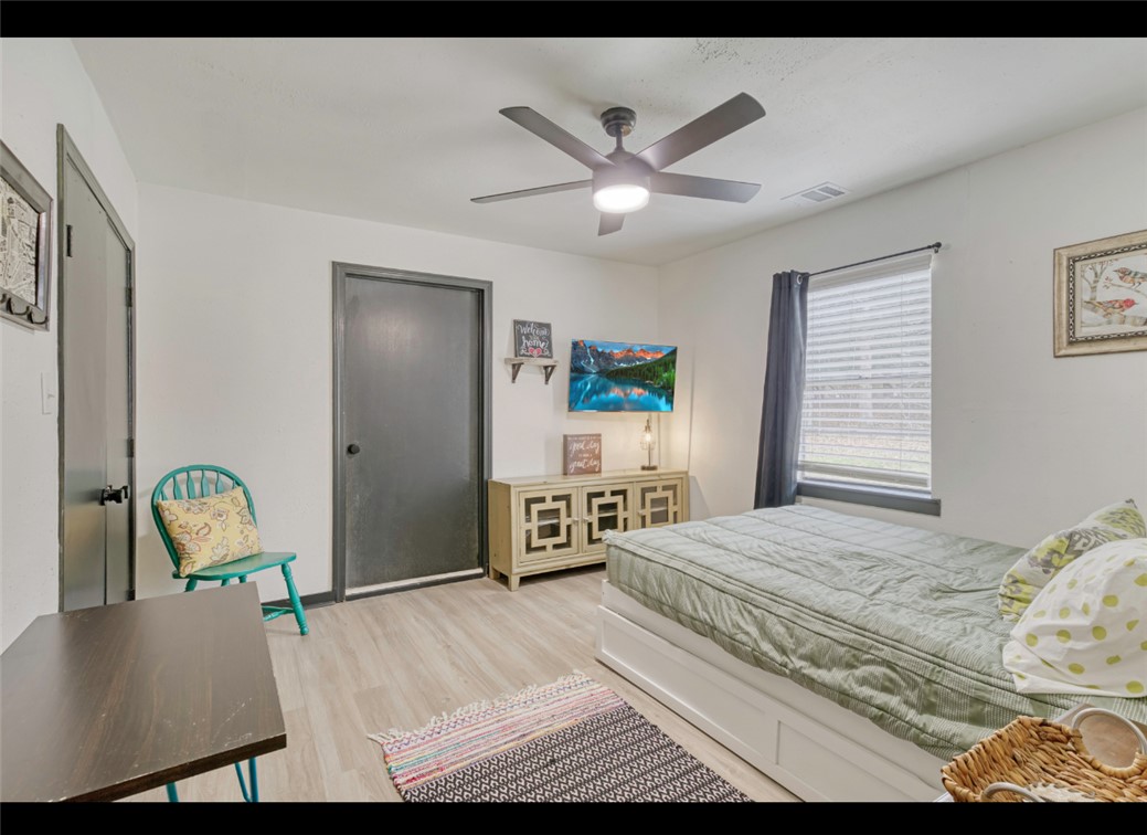 10967 Clyde Acord Road Franklin, TX 77856 - Photo 25 of 50 Bedroom featuring ceiling fan and light wood-type flooring