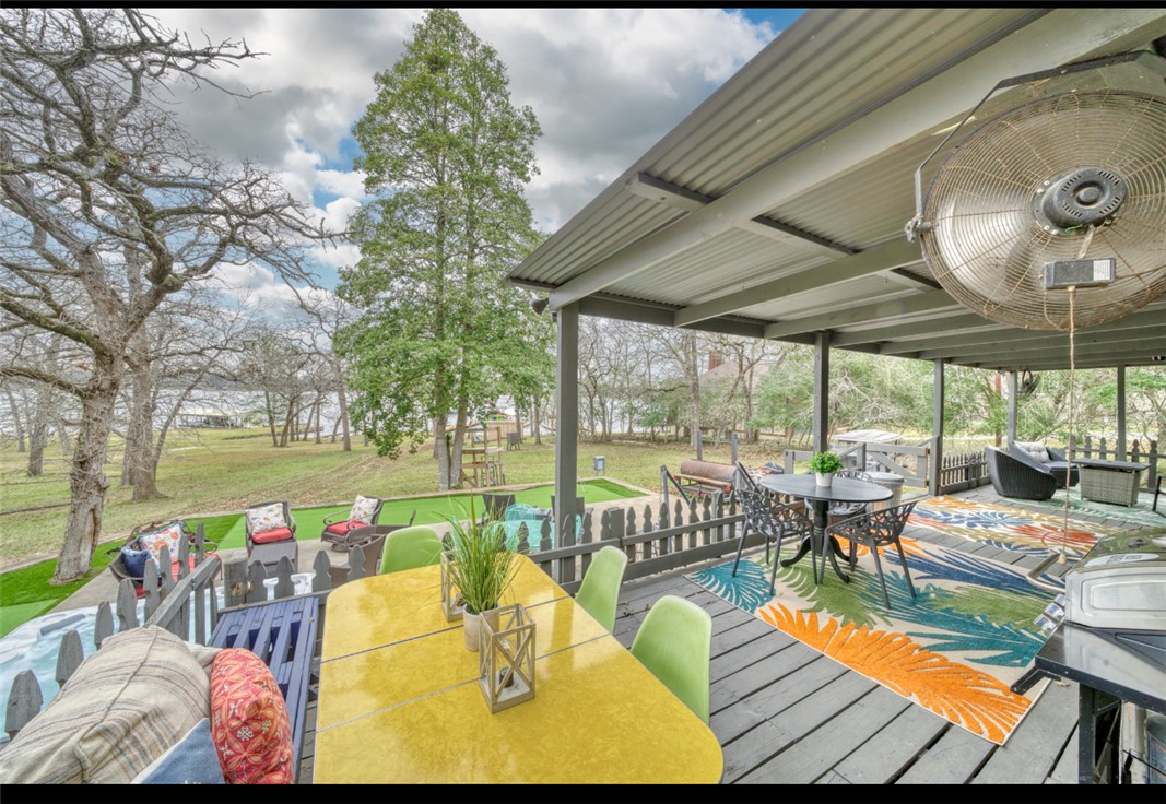 10967 Clyde Acord Road Franklin, TX 77856 - Photo 32 of 50 Deck featuring outdoor lounge area and a yard