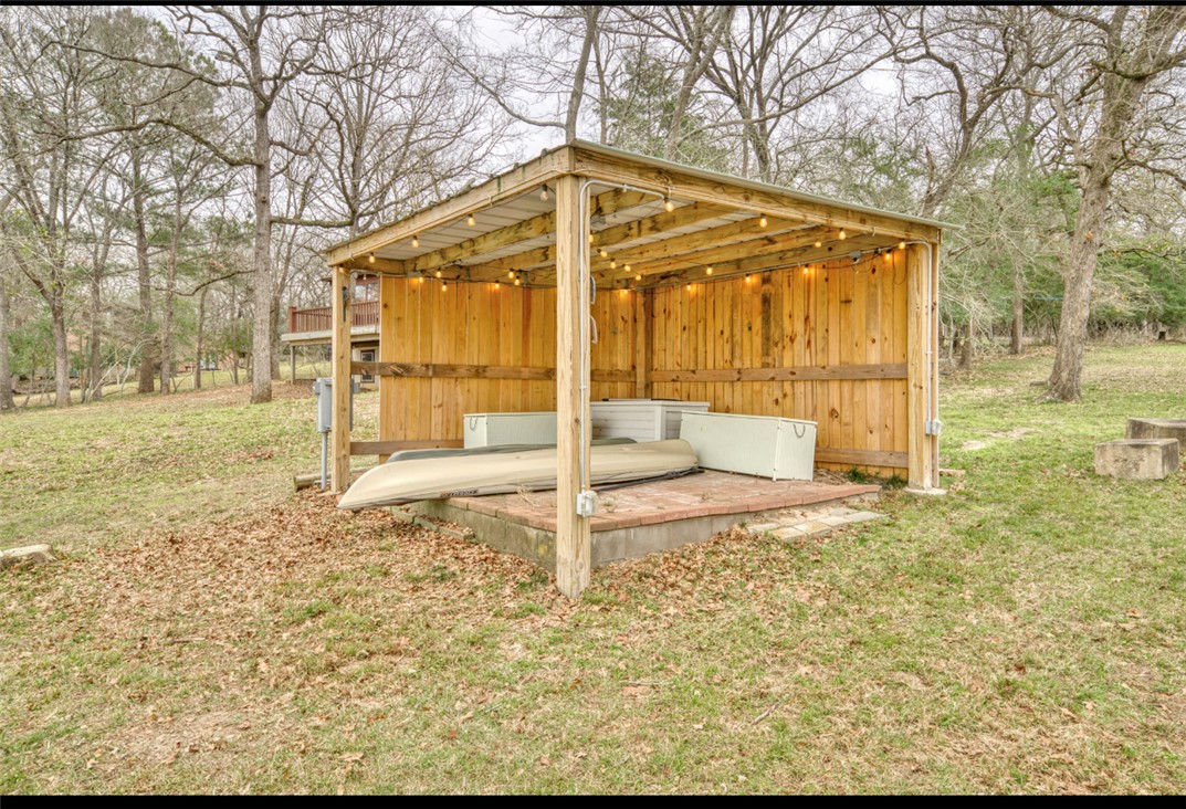 10967 Clyde Acord Road Franklin, TX 77856 - Photo 39 of 50 View of outdoor structure featuring a yard/ with electric