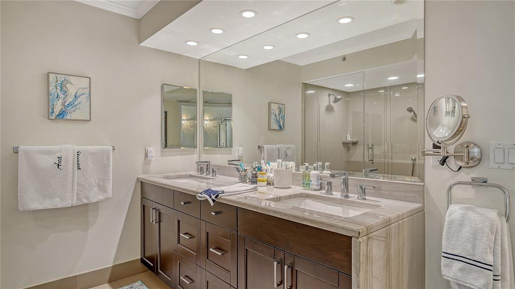 775 Longboat Club Road, Unit 204 Longboat Key, FL 34228 - Photo 22 of 40 a bathroom with a sink double vanity and a mirror