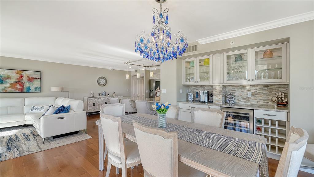 775 Longboat Club Road, Unit 204 Longboat Key, FL 34228 - Photo 6 of 40 a living room with fireplace furniture and a chandelier