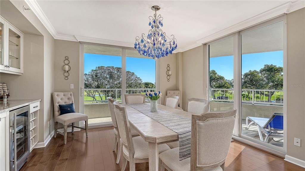 775 Longboat Club Road, Unit 204 Longboat Key, FL 34228 - Photo 8 of 40 a view of a dining room with furniture window and outside view