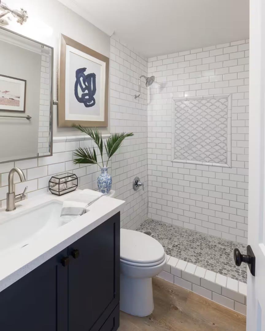 240 Rio Del Mar Boulevard, Unit O Aptos, CA 95003 - Photo 14 of 25 a bathroom with a sink mirror vanity and toilet