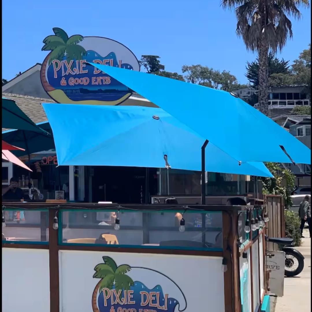 240 Rio Del Mar Boulevard, Unit O Aptos, CA 95003 - Photo 19 of 25 a view of a patio with chairs under an umbrella