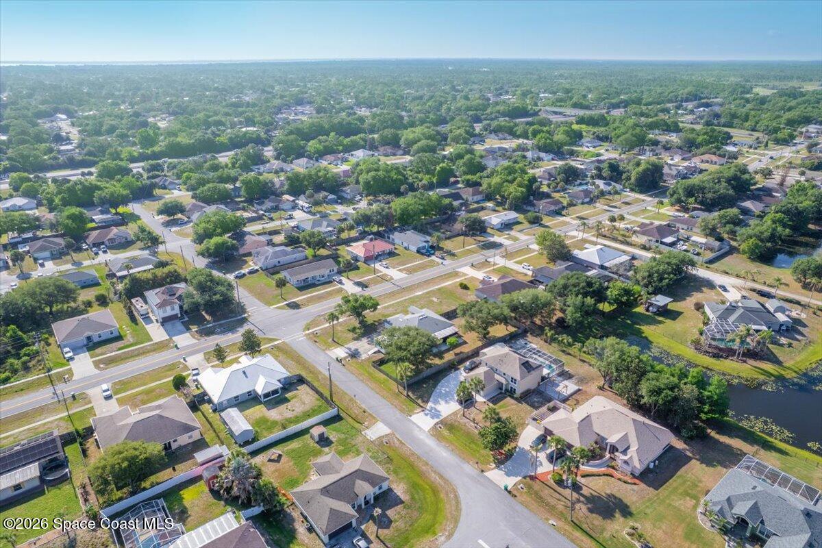 5975 Aruin Street Cocoa, FL 32927 - Photo 55 of 70 an aerial view of residential houses with outdoor space