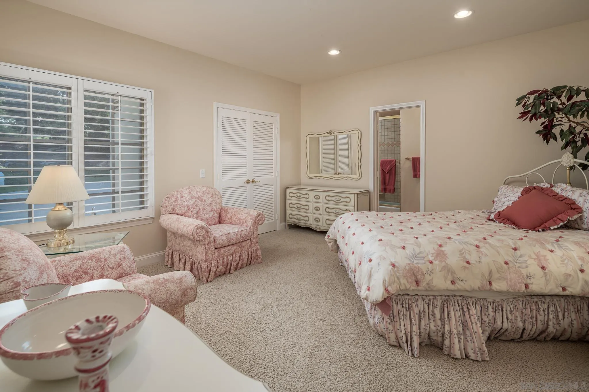 18221 Via Ascenso Rancho Santa Fe, CA 92067 - Photo 22 of 37 a bedroom with a bed and a couch