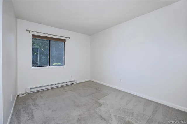 a view of a hallway with a white walls