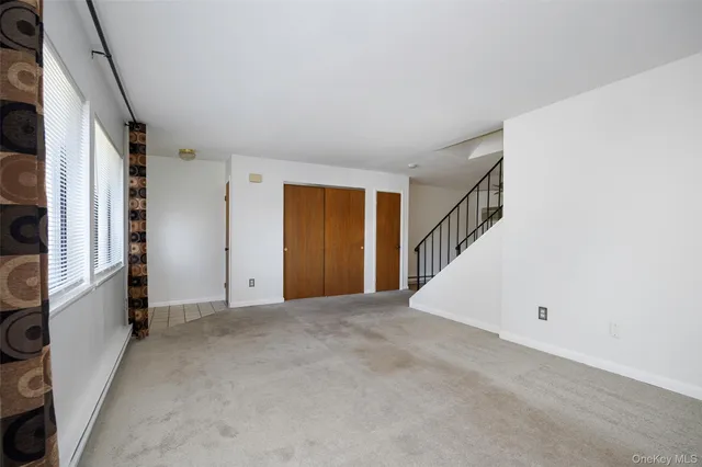 a kitchen with stainless steel appliances granite countertop a refrigerator a sink dishwasher and a stove with wooden floor