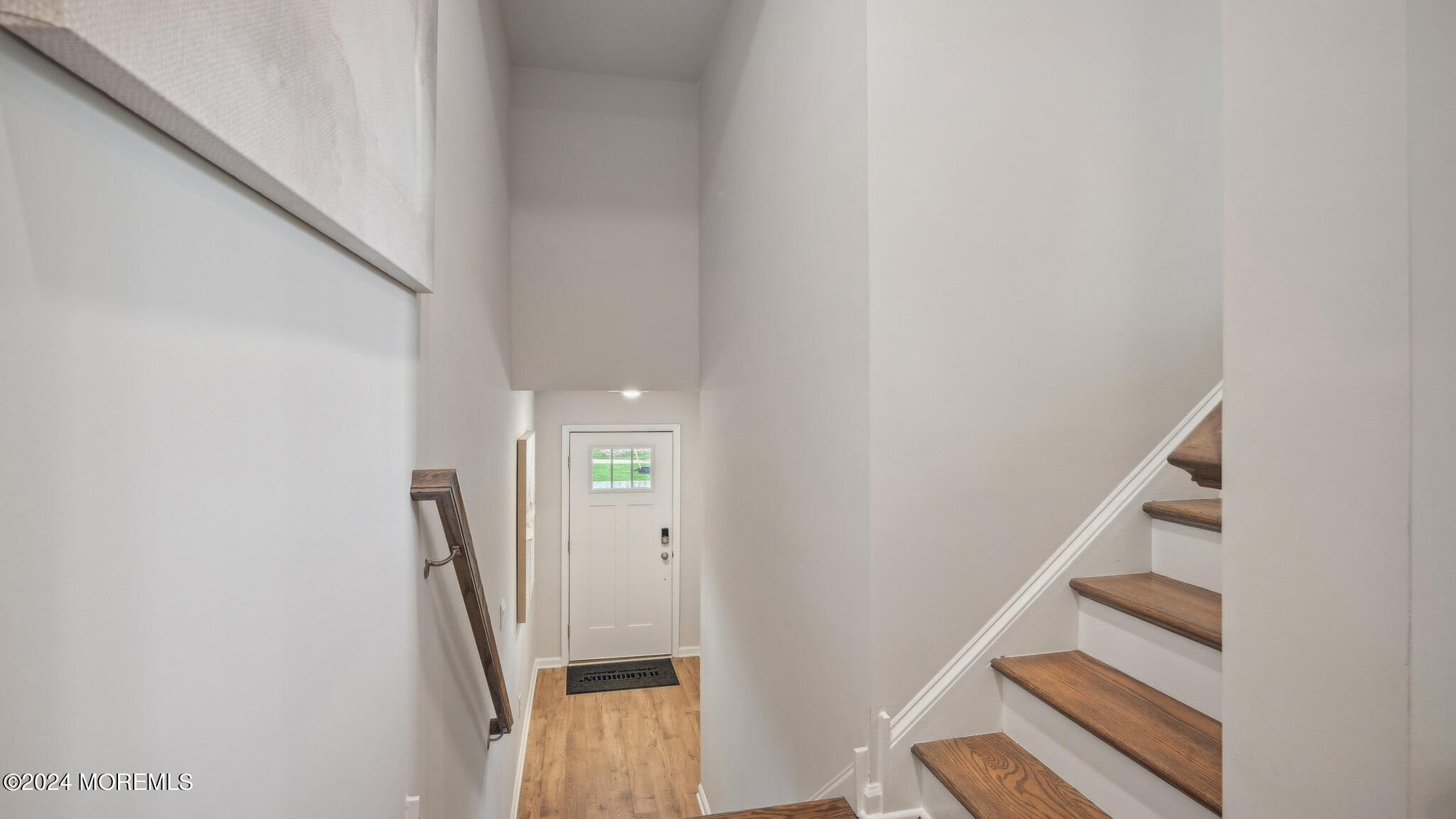 10 Rothbury Court Tinton Falls, NJ 07753 - Photo 2 of 43 a view of a livingroom with wooden floor and stairs