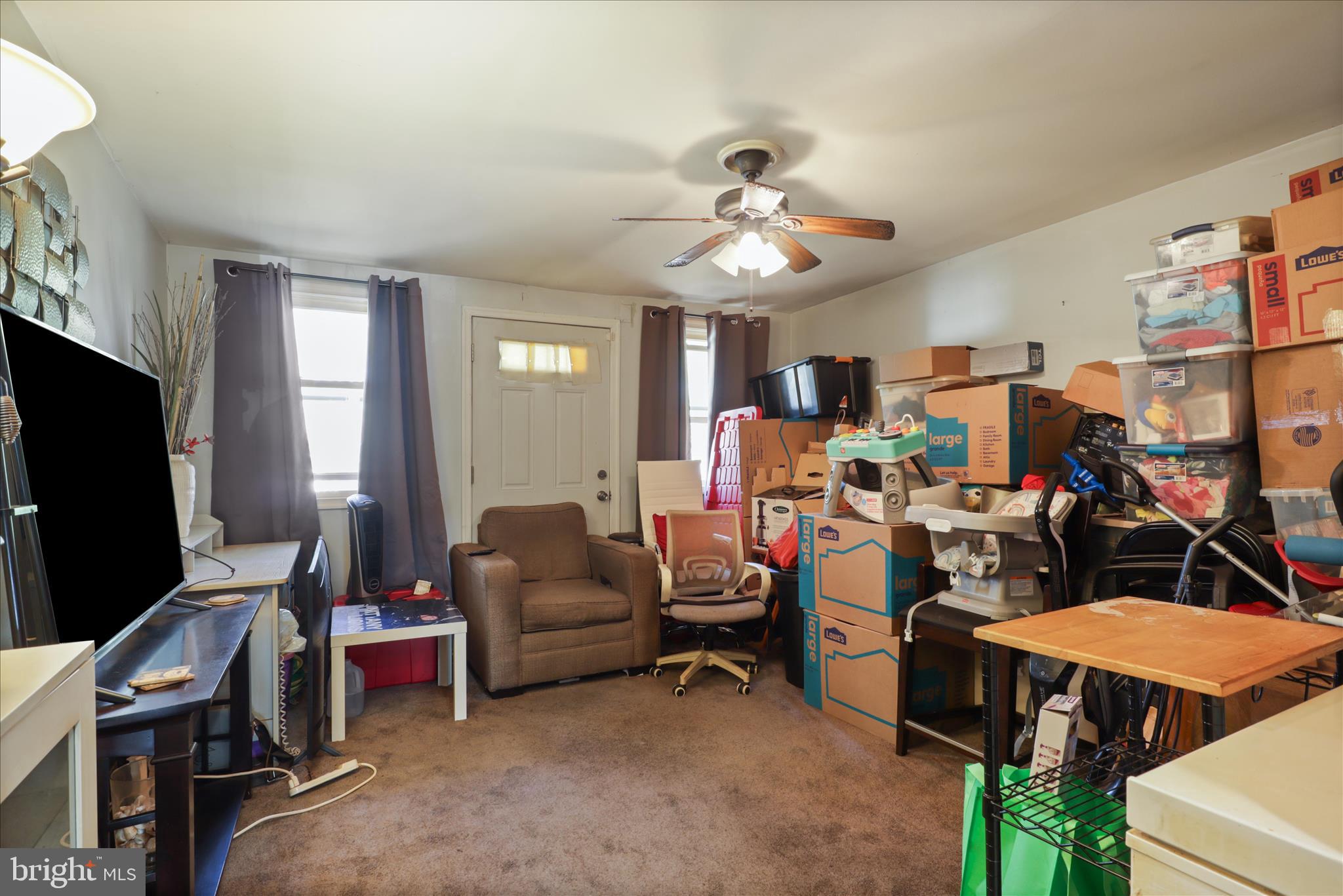 7750 Normandy Road Landover, MD 20785 - Photo 12 of 27 a view of a livingroom with furniture and a window
