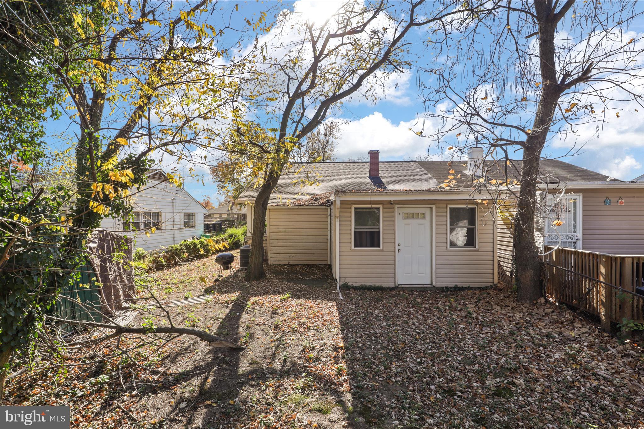 7750 Normandy Road Landover, MD 20785 - Photo 20 of 27 a white house that has a tree in front of it