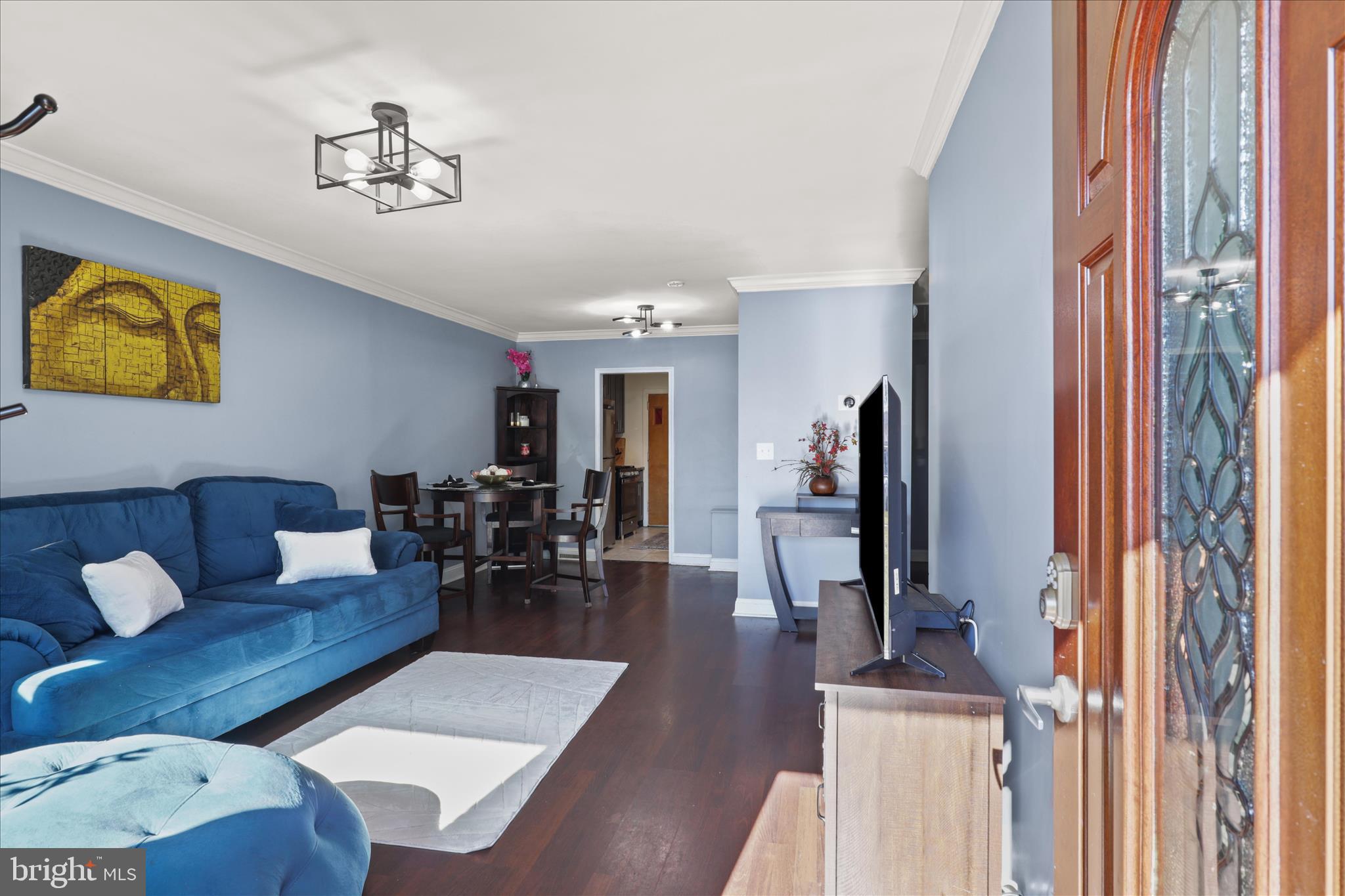 7750 Normandy Road Landover, MD 20785 - Photo 5 of 27 a living room with furniture and wooden floor