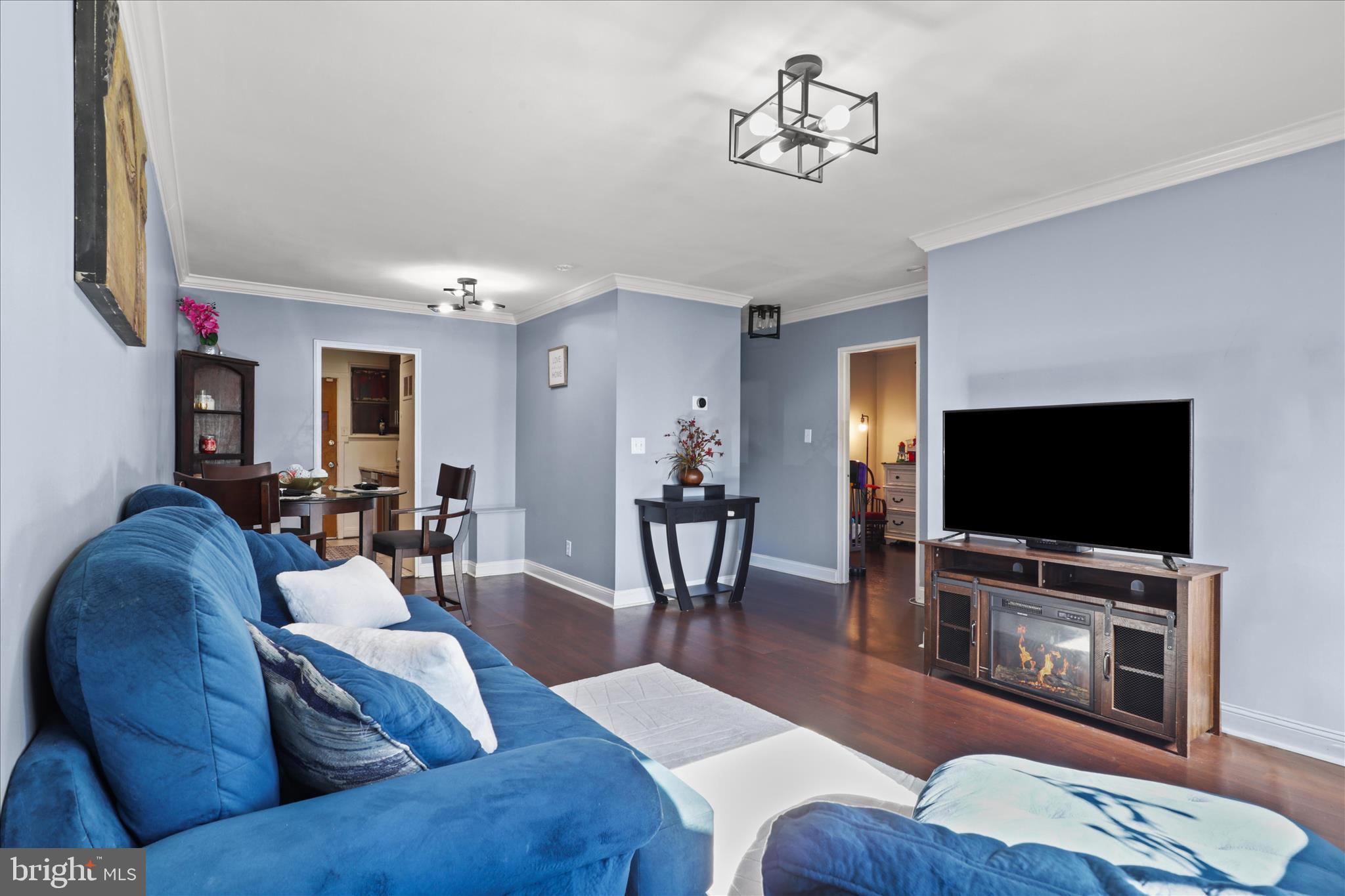 7750 Normandy Road Landover, MD 20785 - Photo 6 of 27 a living room with furniture and a flat screen tv
