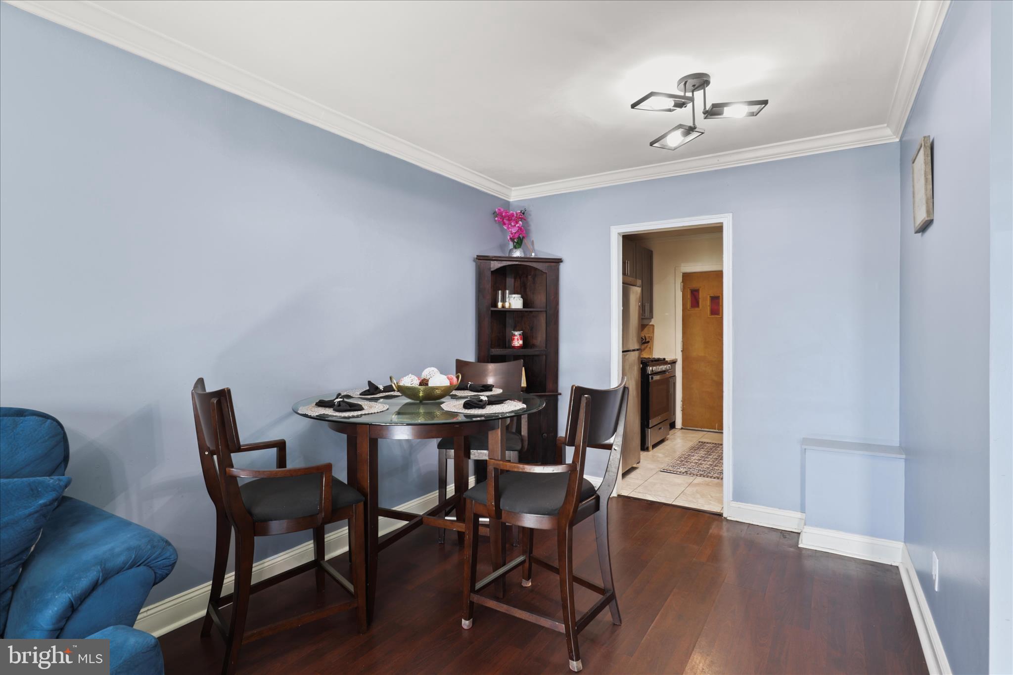 7750 Normandy Road Landover, MD 20785 - Photo 8 of 27 a view of a dining room with furniture and wooden floor