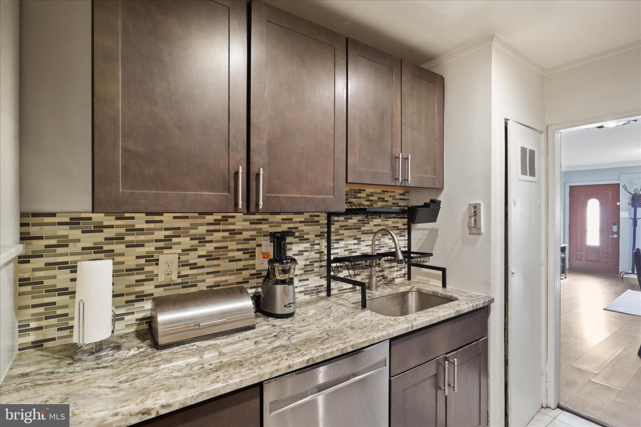 7750 Normandy Road Landover, MD 20785 - Photo 10 of 27 a bathroom with a granite countertop sink and a mirror