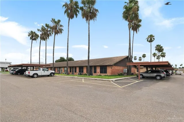 a view of swimming pool with a table and chairs