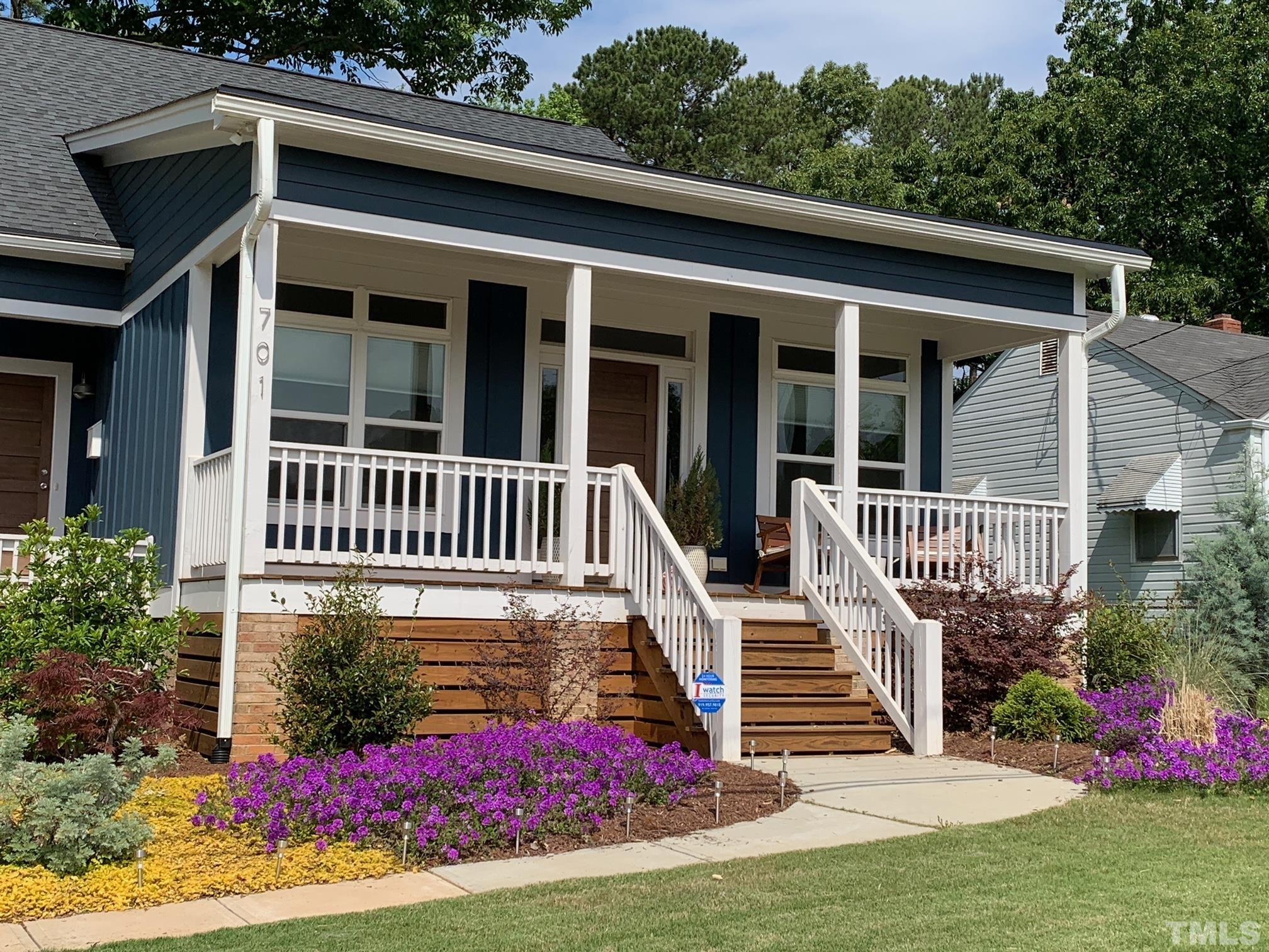 701 Colleton Road Raleigh, NC 27610 - Photo 1 of 39 a view of a house with wooden deck and a yard