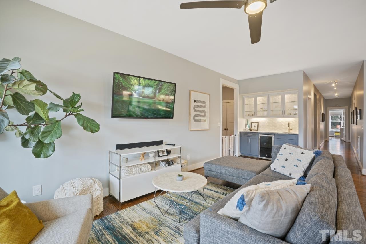 701 Colleton Road Raleigh, NC 27610 - Photo 15 of 39 a living room with furniture and a flat screen tv