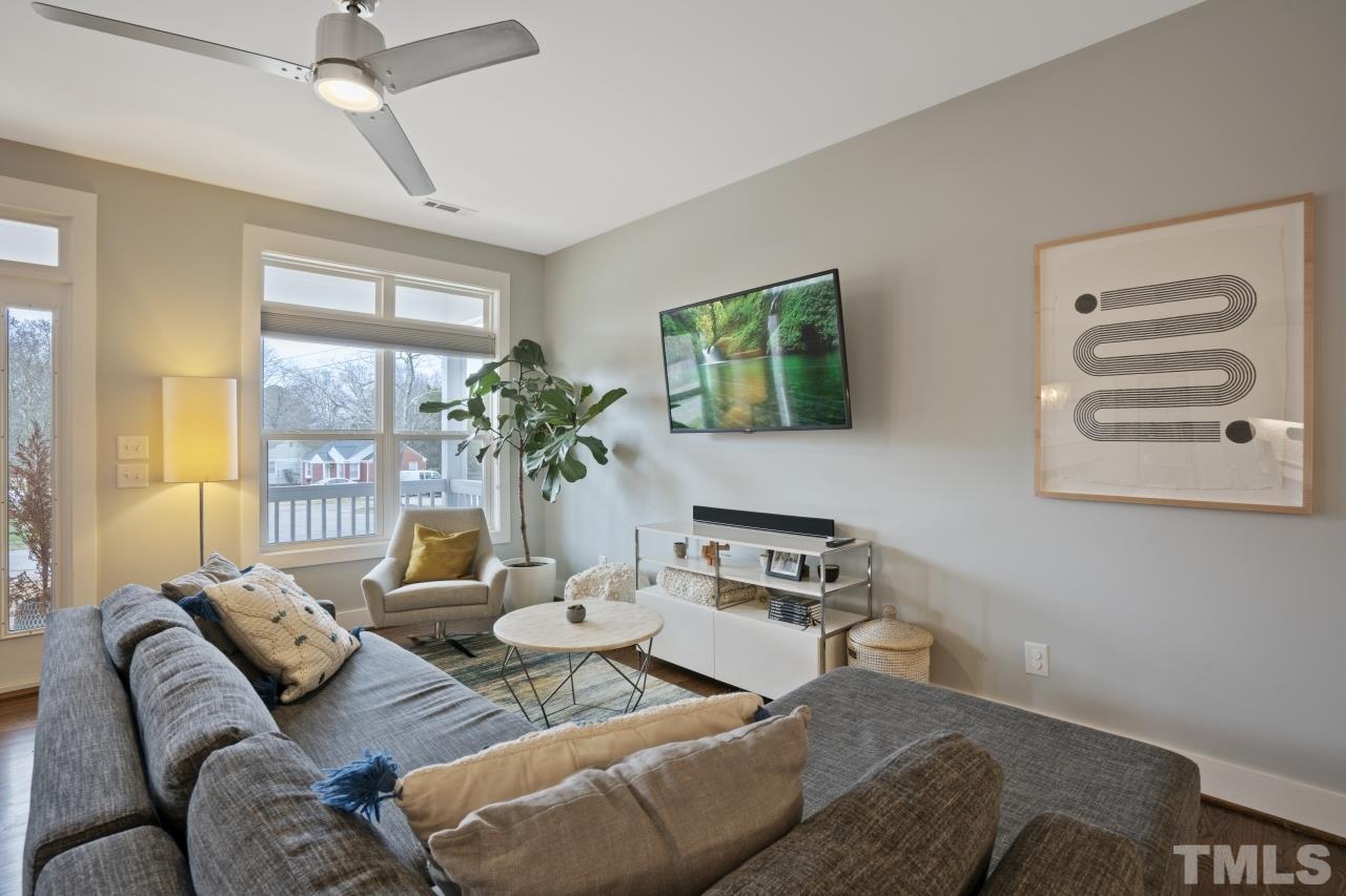 701 Colleton Road Raleigh, NC 27610 - Photo 16 of 39 a living room with furniture and a large window