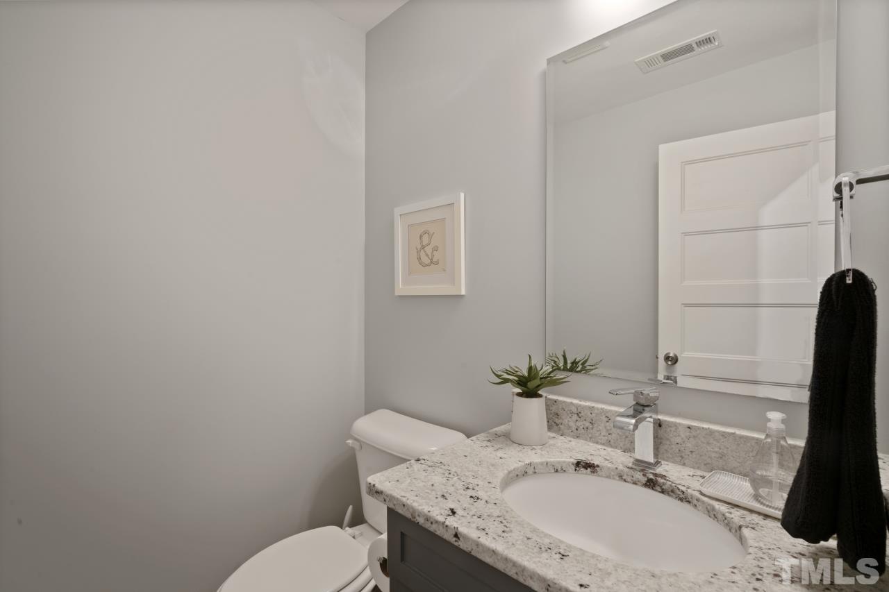 701 Colleton Road Raleigh, NC 27610 - Photo 18 of 39 a bathroom with a sink and a toilet