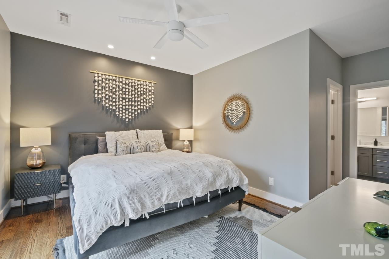 701 Colleton Road Raleigh, NC 27610 - Photo 19 of 39 a bedroom with a bed and a table in it