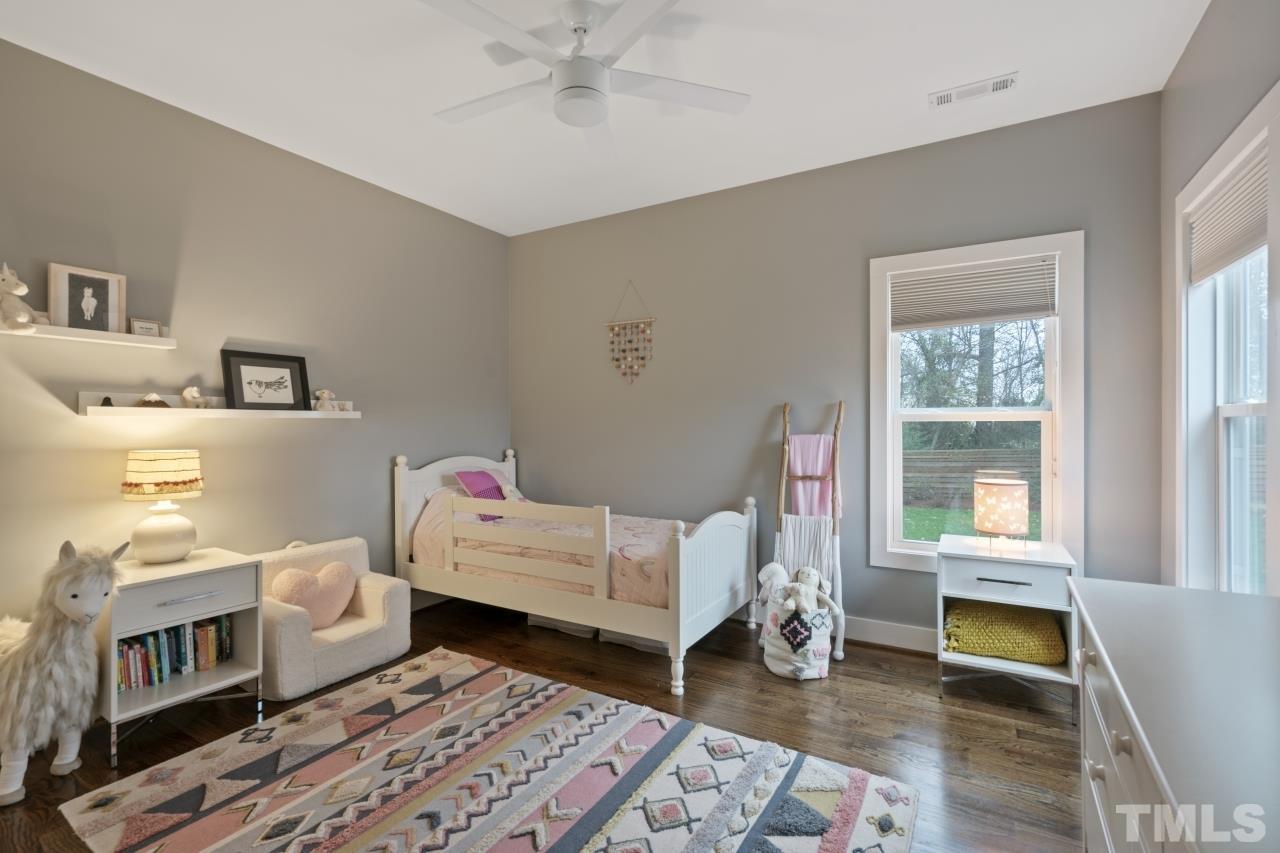 701 Colleton Road Raleigh, NC 27610 - Photo 24 of 39 a bedroom with furniture and a window