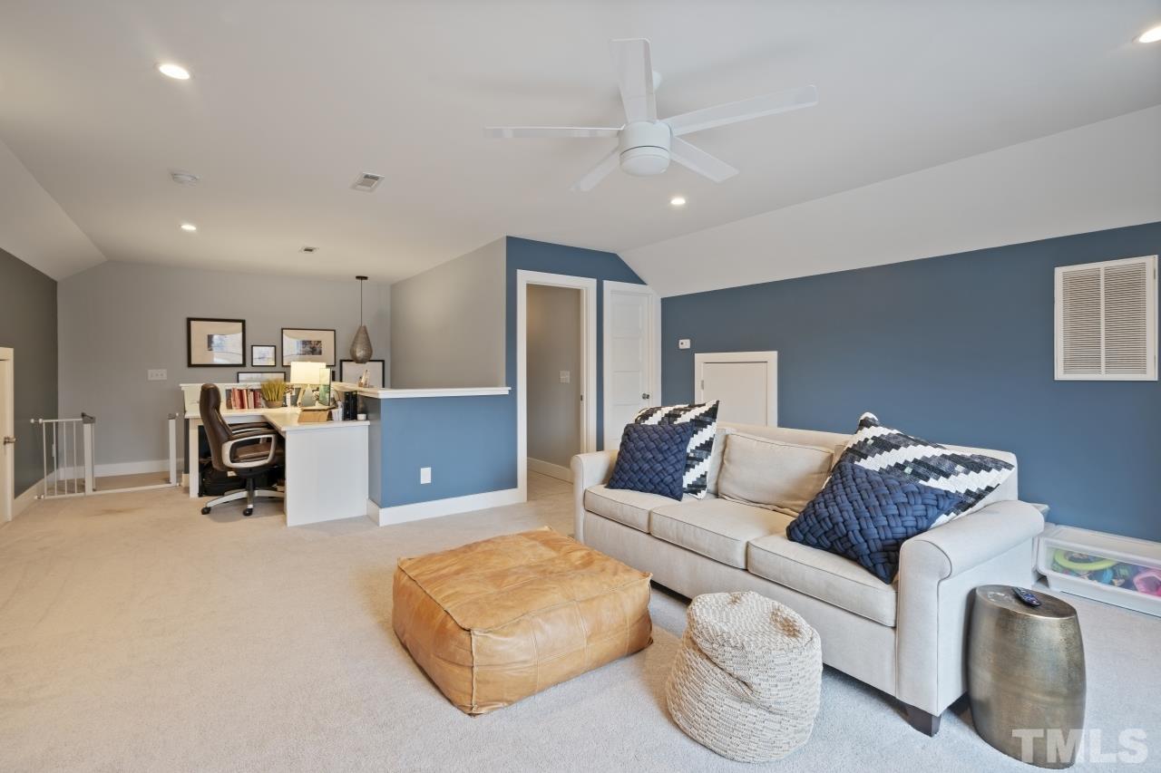 701 Colleton Road Raleigh, NC 27610 - Photo 30 of 39 a living room with furniture and a couch