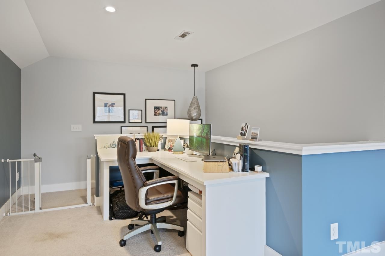 701 Colleton Road Raleigh, NC 27610 - Photo 31 of 39 a view of a workspace with furniture