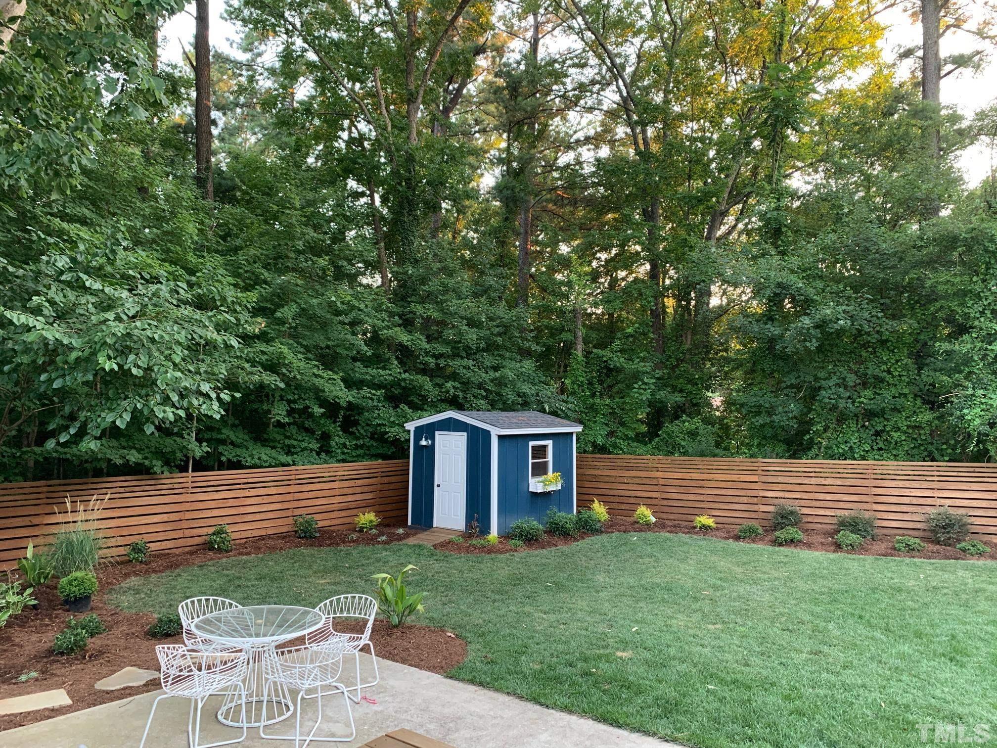 701 Colleton Road Raleigh, NC 27610 - Photo 39 of 39 a backyard of a house with table and chairs