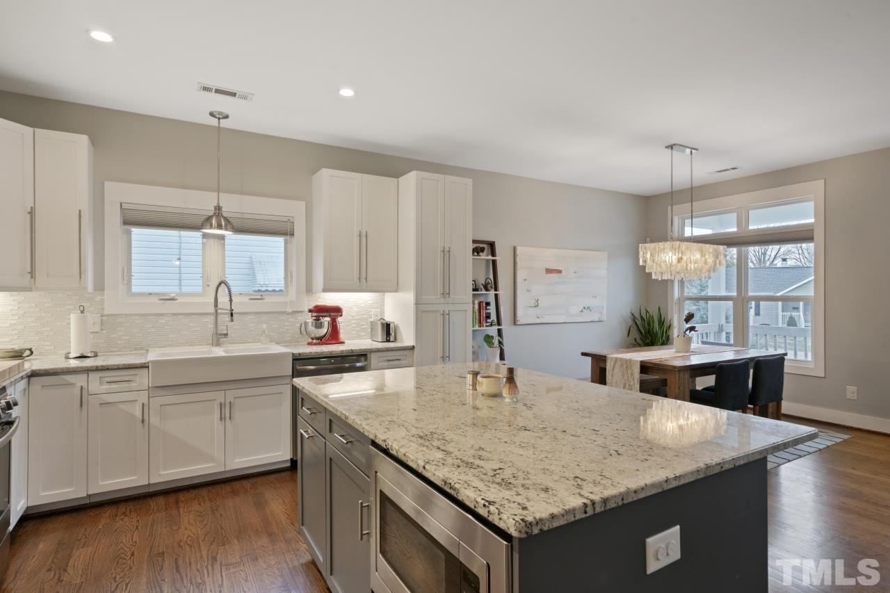 701 Colleton Road Raleigh, NC 27610 - Photo 8 of 39 a kitchen with center island and sink