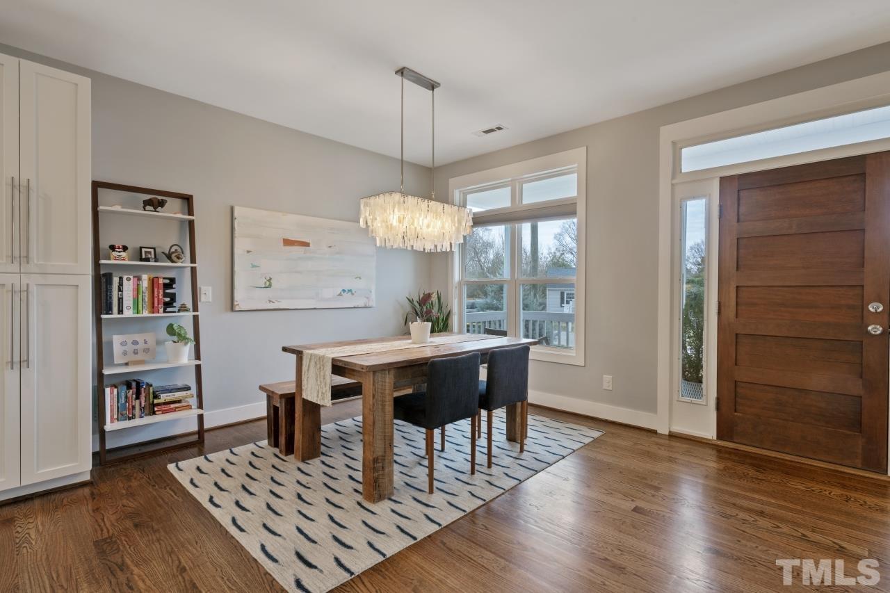 701 Colleton Road Raleigh, NC 27610 - Photo 10 of 39 a view of a dining room with furniture window and wooden floor