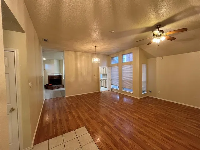 a bathroom with a tub a sink and a mirror