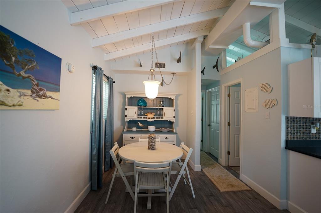 3480 Harbor Drive Weeki Wachee, FL 34607 - Photo 14 of 31 a dining room with furniture and wooden floor