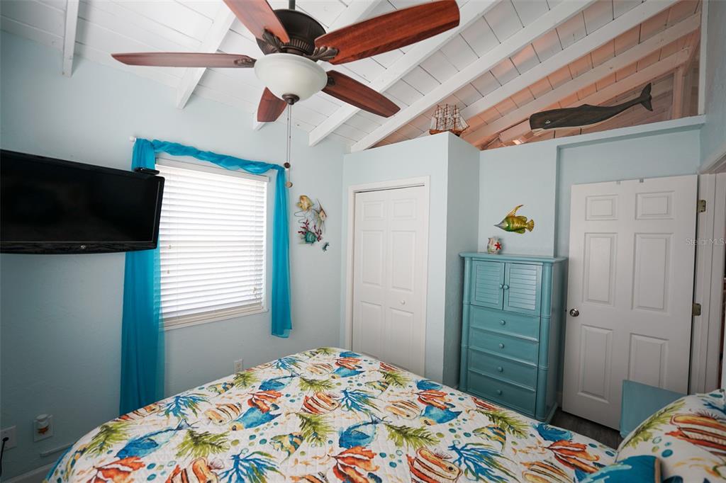3480 Harbor Drive Weeki Wachee, FL 34607 - Photo 22 of 31 a bedroom with a bed and a tv