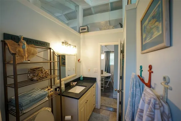 a bathroom with a sink and mirror