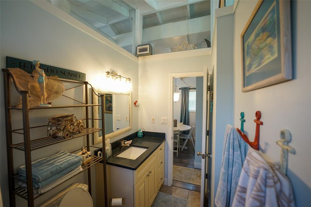 3480 Harbor Drive Weeki Wachee, FL 34607 - Photo 24 of 31 a bathroom with a sink and mirror