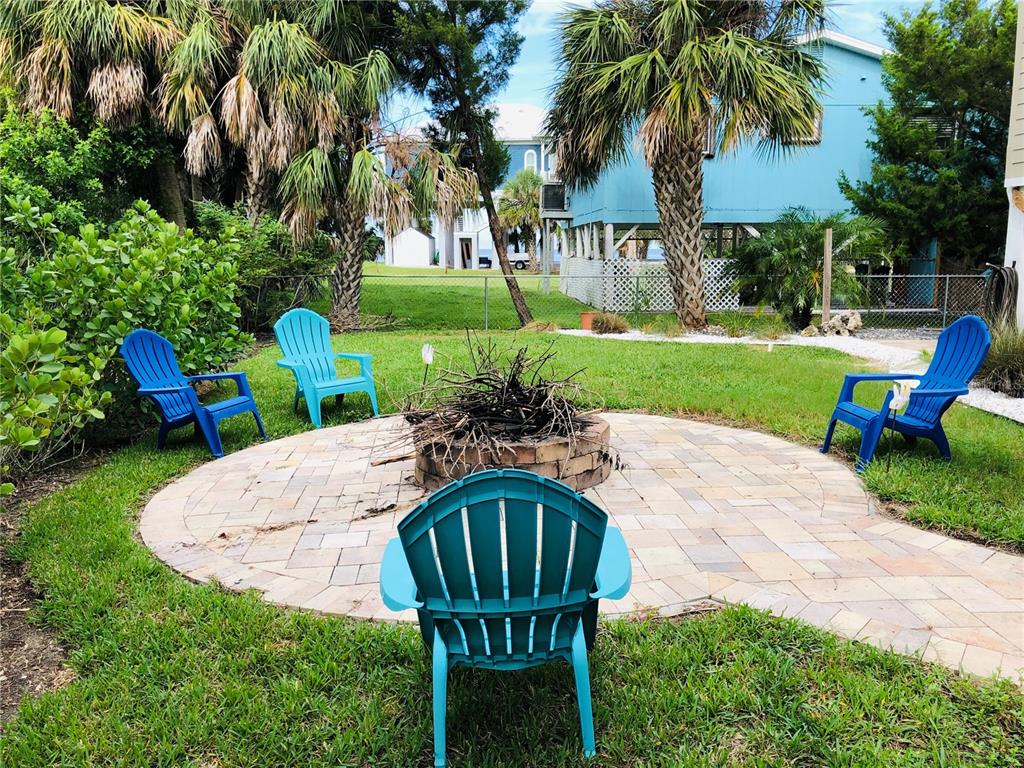 3480 Harbor Drive Weeki Wachee, FL 34607 - Photo 7 of 31 a view of a table and chairs in the garden