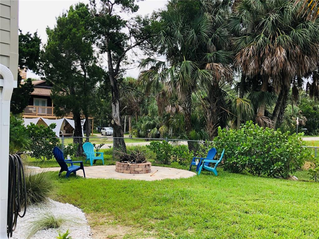 3480 Harbor Drive Weeki Wachee, FL 34607 - Photo 8 of 31 a view of a garden with a fountain