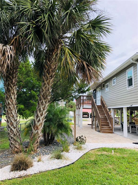 3480 Harbor Drive Weeki Wachee, FL 34607 - Photo 9 of 31 a front view of a house with a yard