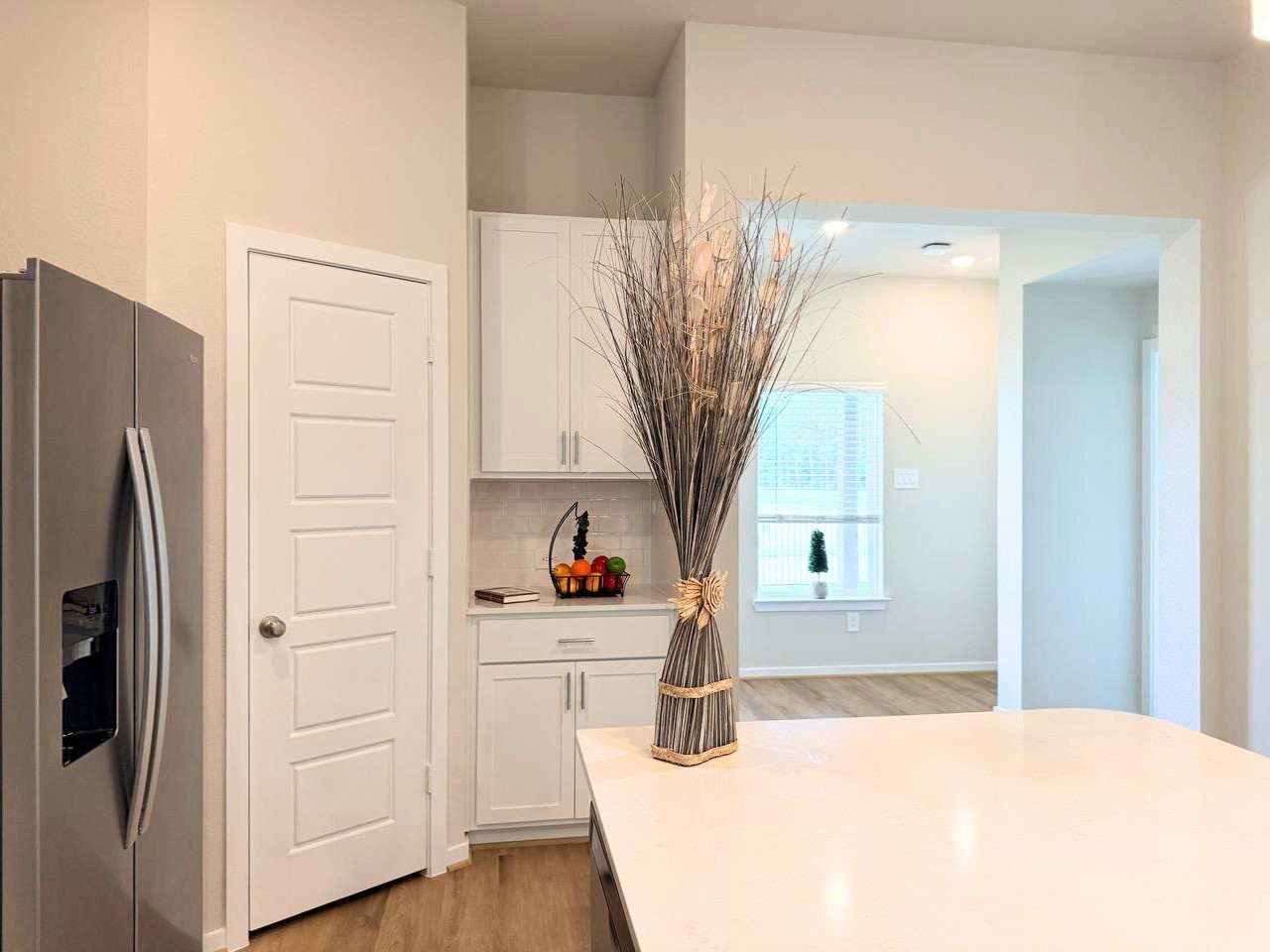 16246 Parish Pointe Court Conroe, TX 77302 - Photo 18 of 32 a kitchen with stainless steel appliances a refrigerator and cabinets