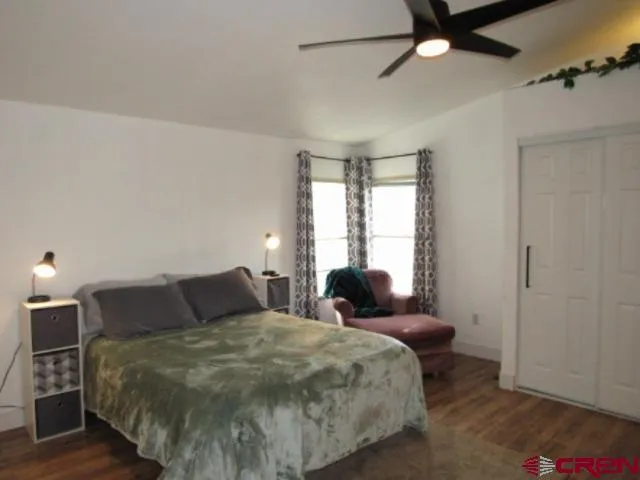 a bedroom with a bed and window