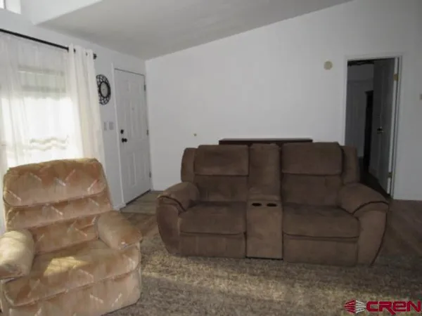a living room with furniture and a couch